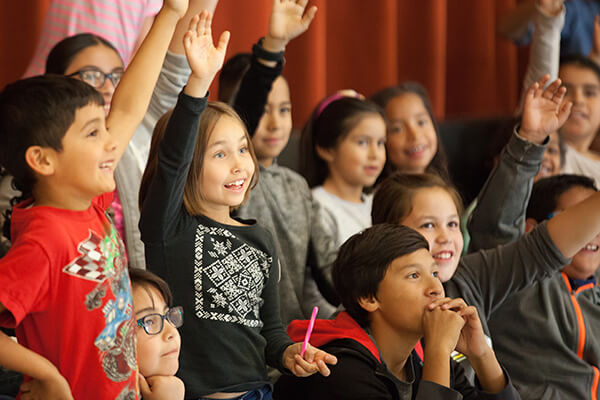 students raising hans