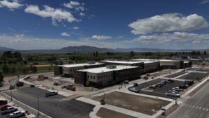 Angled exterior drone shot view of Shoreline Elementary including skyline