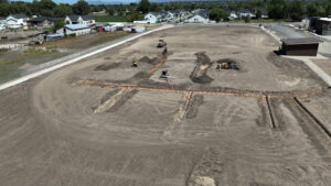 A drone shot of the field, hashed with shovel dig marks, ready for irrigation installation