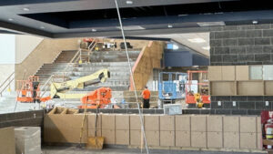 A wideshot of a crane moving materials inside of the Shoreline building.