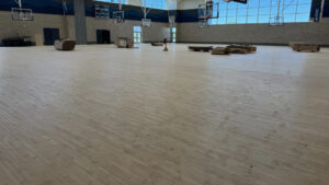 A gymnasium floor, pre-paint.