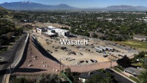 Drone shot of Wasatch Elementary construction site, the parking lot, and surrounding road.