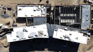 An overhead image of the Wasatch building, demonstrating that roofing is mostly complete.