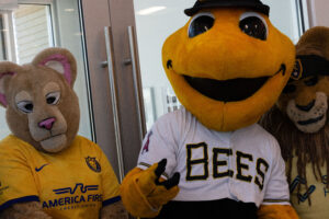 Local Sports Mascots pose for the camera at the America First Ribbon Cutting.