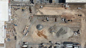 Bird's eye view drone shot of the bulldozed lot. 