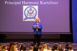 Principal Harmony Kartchner in front of assembly