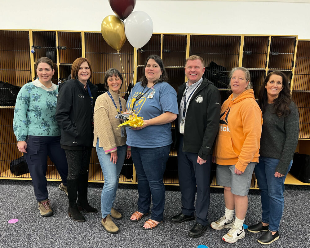 Teacher Christy Giblon stands in the center of the Foundation group, including Superintendent Dau and Principal Hirshi. 