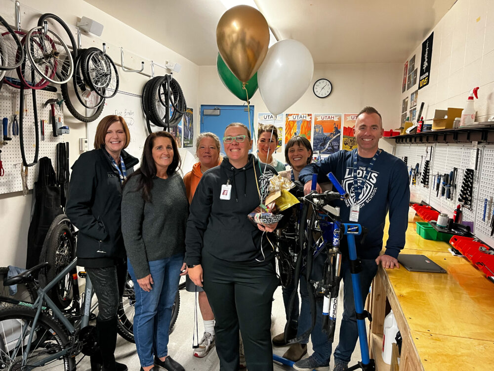 Teacher Alice Ficklin stands in the center of the Foundation group, including Superintendent Dau and Principal Griffin. 