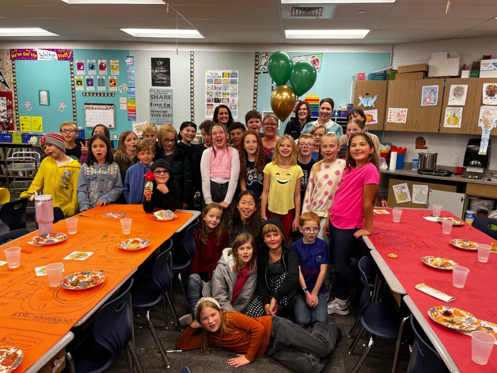 Teacher Brenda Miller stands in the center of the Foundation group, including Superintendent Dau. 